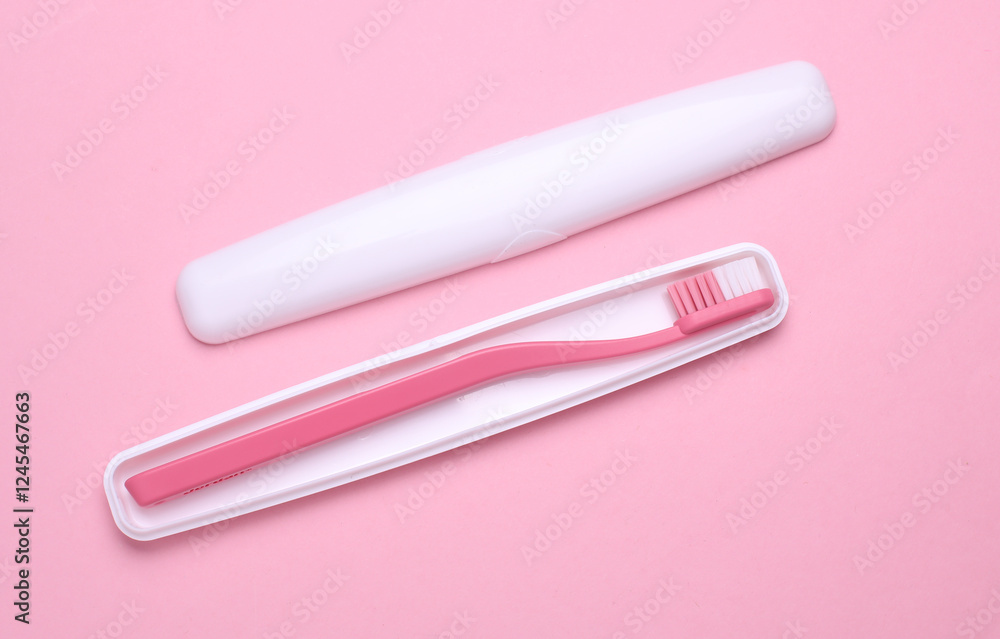 Plastic case with toothbrush on pink background Plastic case with toothbrush on pink background
