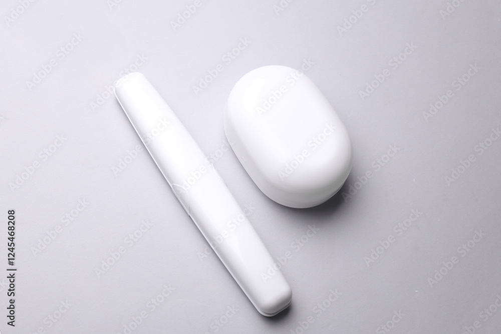 Toothbrush case and soap dish on gray background Toothbrush case and soap dish on gray background