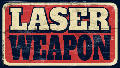 Aged retro laser weapon sign on wood
