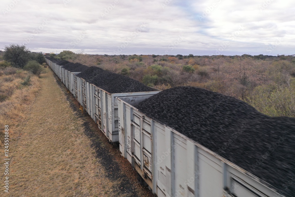 Coal rail wagon loading at Morupule Coal Mine near in Palapye, Botswana, Africa Coal rail wagon loading at Morupule Coal Mine near in Palapye, Botswana, Africa