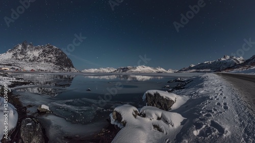 Snow blankets the ground while the moonlit landscape reveals mountains towering over a tranquil lake. Stars twinkle brightly above, creating a serene winter atmosphere along the remote road