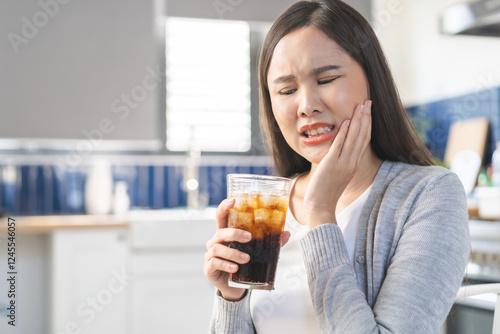Health care asian young woman touching mouth, expression, girl suffering from toothache, decay or sensitivity cavity molar tooth or inflammation drink cold, sparkling water. Sensitive teeth people.