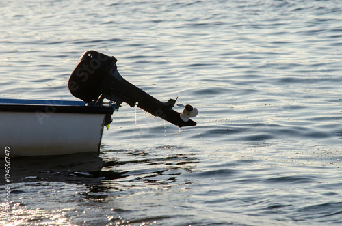 fishing boat in the water whit hold engine