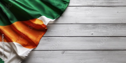 Irish Flag Draped on Rustic Wooden Background: Celebrating Irish Heritage and Culture photo