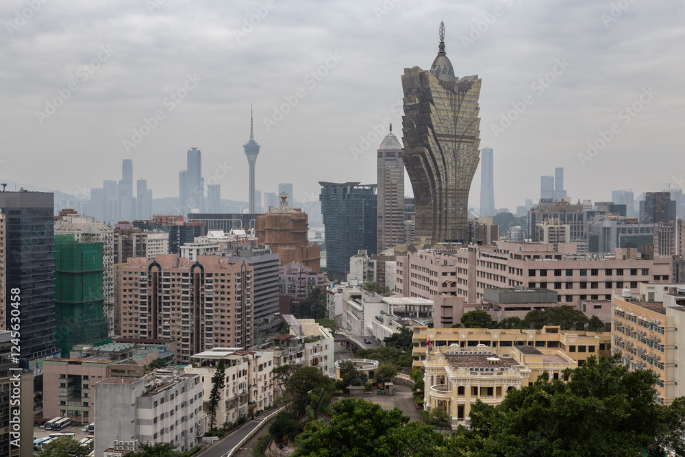 Fototapeta premium Iconic Grand Lisboa building under cloudy skies in Macau
