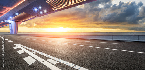 Obraz na płótnie Asphalt road and bridge with beautiful coastline scenery at sunset. Outdoor road background. w salonie