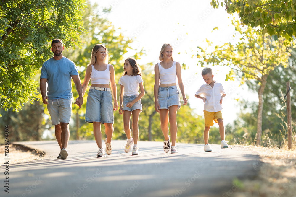 Fototapeta premium Family enjoying a leisurely walk in nature