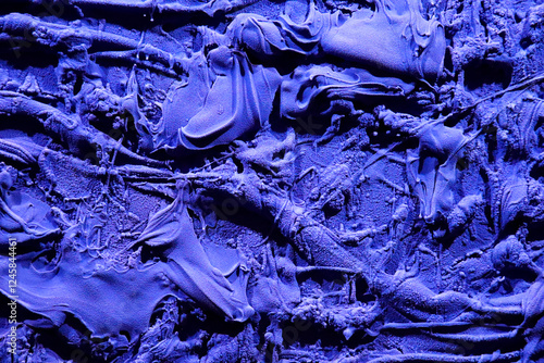 Background of blue oil color with sand on palette photo