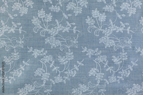 Obraz na plátně natural blue fabric with embroidered floral patterns