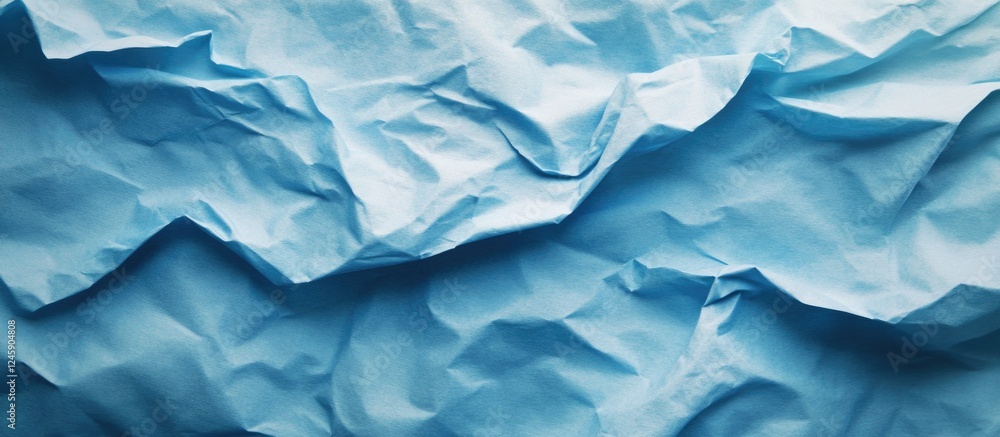 Textured crumpled blue paper background for creative design or artistic presentations Textured crumpled blue paper background for creative design or artistic presentations