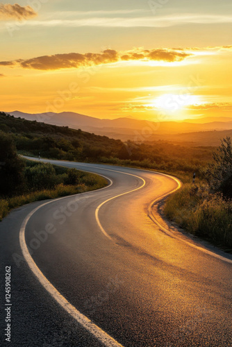 Sunset over the winding road with cypresses in Tuscany
