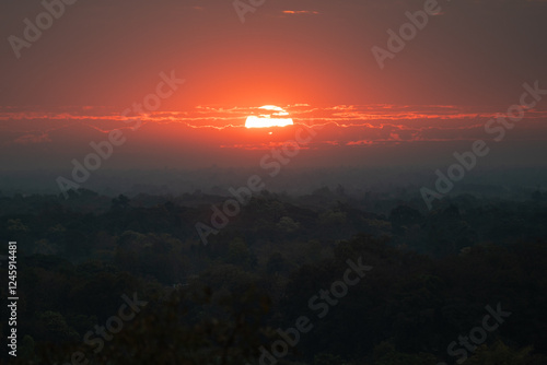 Sunrise from Saphan Hin temple. Sukhothai Historical Park, Thailand. photo