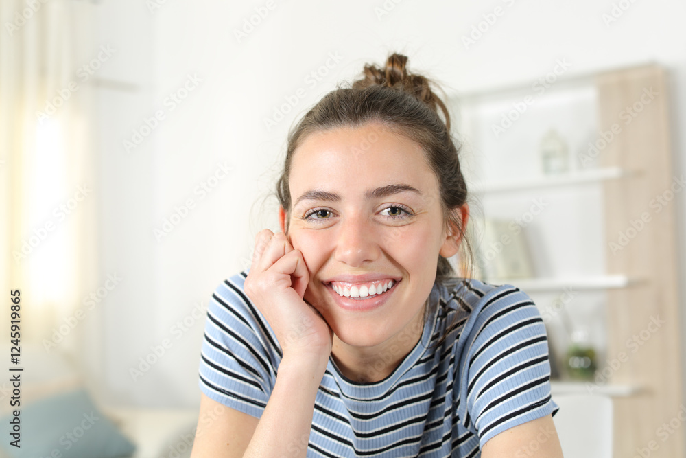Happy woman with perfect teeth smiling at you at home Happy woman with perfect teeth smiling at you at home