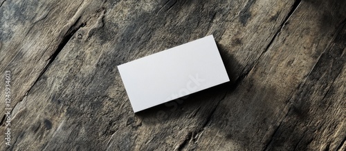 Blank business card mockup on rustic wooden background for personalized design and branding presentations. Ideal for corporate identity projects. photo