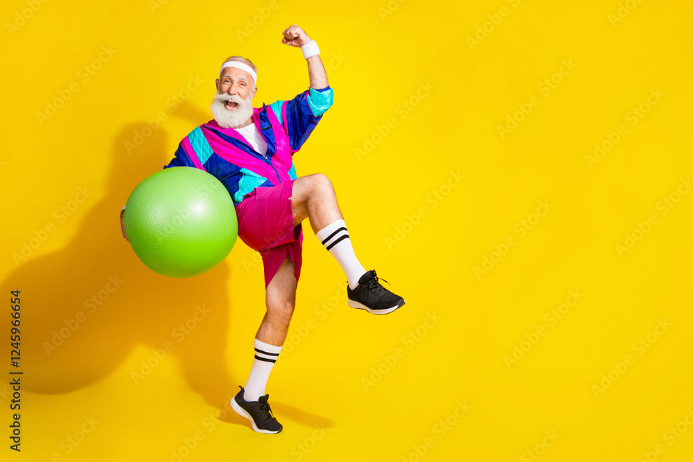 Full length photo of sportive lucky modern pensioner dressed vintage jacket holding fit ball emtpy space isolated yellow color background Full length photo of sportive lucky modern pensioner dressed vintage jacket holding fit ball emtpy space isolated yellow color background