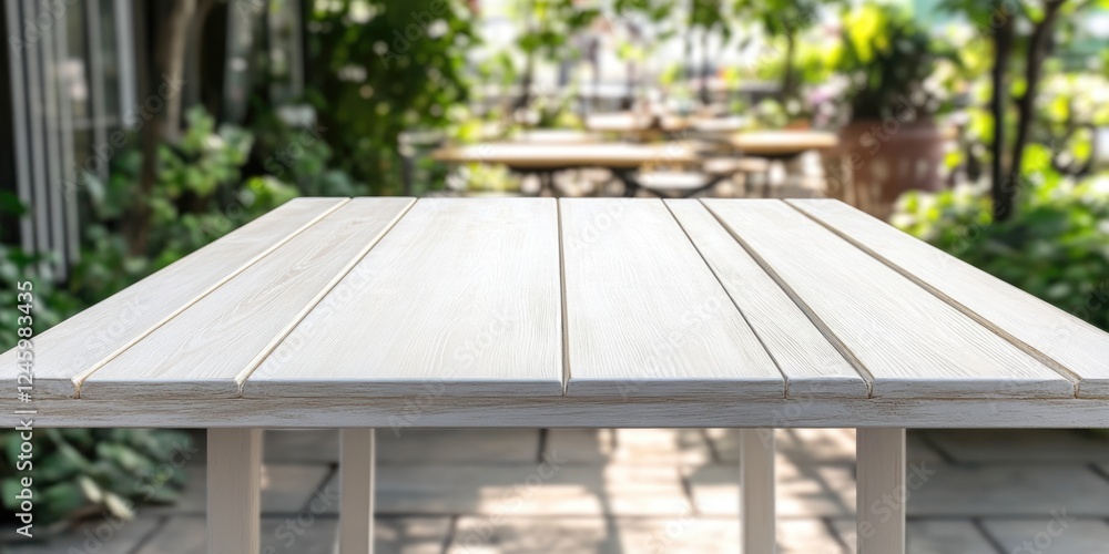 Empty white wooden table ready for product display in sunny coffee shop with blurred background and ample copy space for text or branding. Empty white wooden table ready for product display in sunny coffee shop with blurred background and ample copy space for text or branding.
