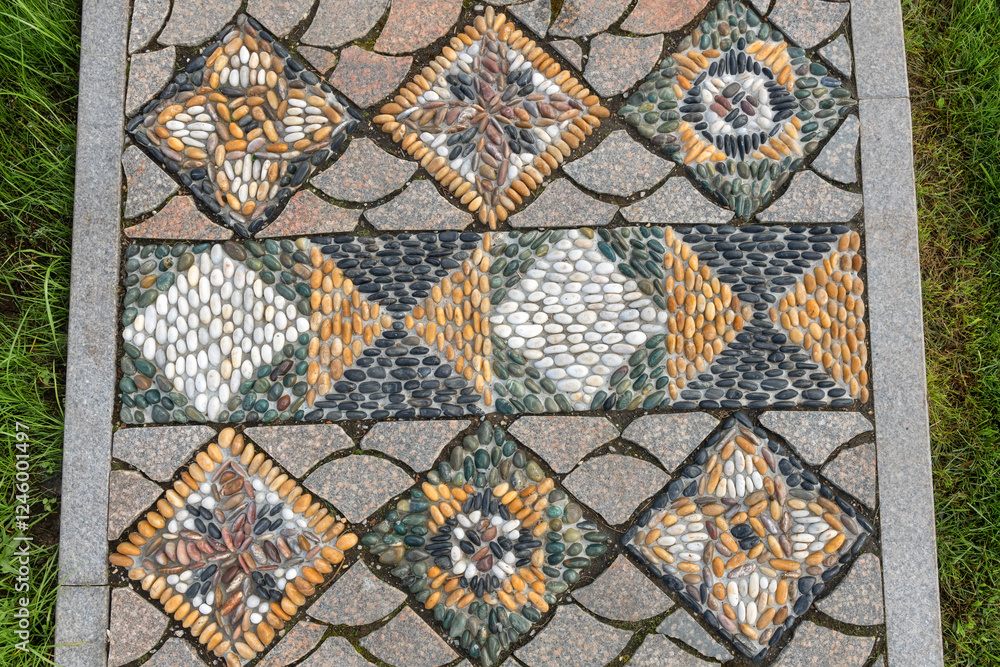 YEKATERINBURG, RUSSIA - August 9, 2024: A pattern of stones on a path in the park of the Alexander Nevsky Novo-Tikhvin Convent. Ekaterinburg YEKATERINBURG, RUSSIA - August 9, 2024: A pattern of stones on a path in the park of the Alexander Nevsky Novo-Tikhvin Convent. Ekaterinburg