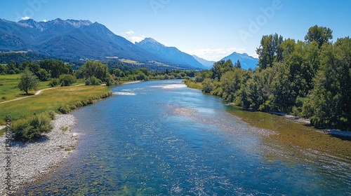 River flows through valley, mountains background; summer landscape, nature travel