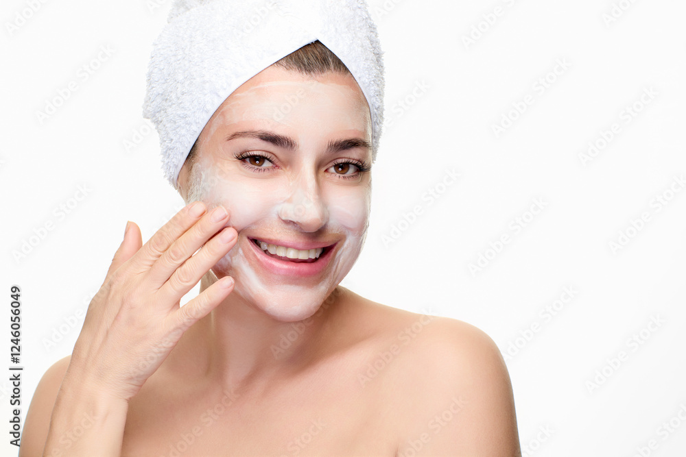 Woman enjoying skincare routine with facial mask and towel Woman enjoying skincare routine with facial mask and towel