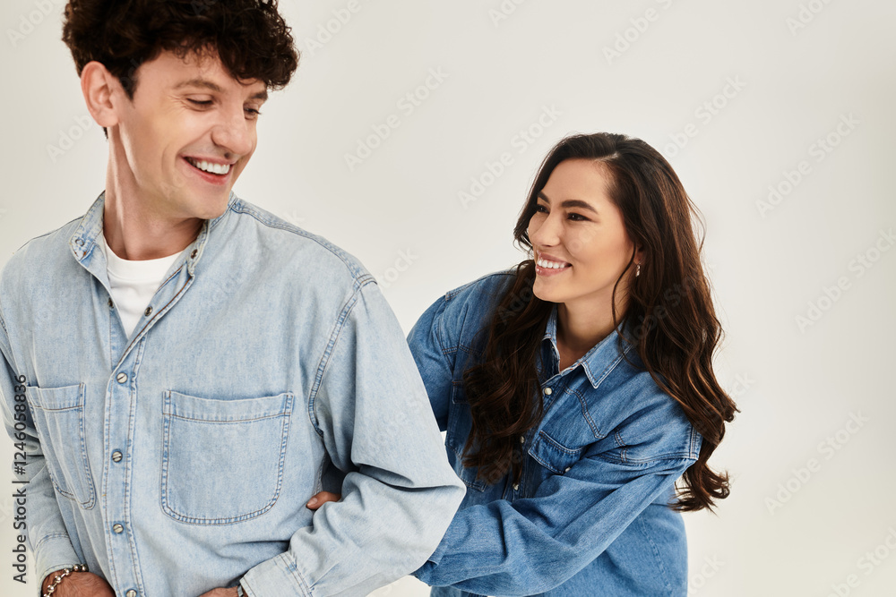 Stylish young couple having fun in a modern studio environment with trendy outfits Stylish young couple having fun in a modern studio environment with trendy outfits