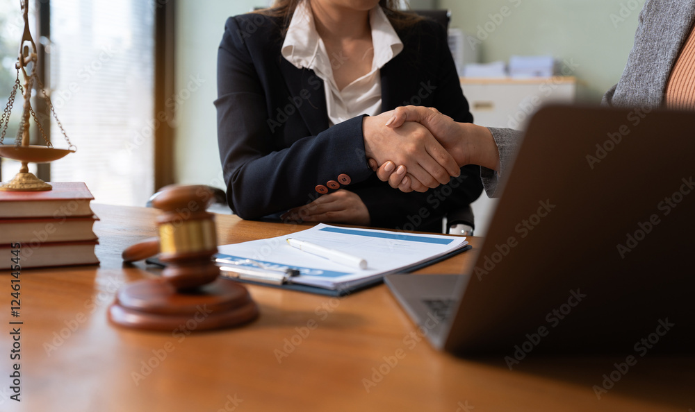 Lawyer, Client Handshake After Final Contract Agreement. Lawyer, Client Handshake After Final Contract Agreement.