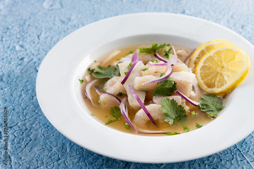 Traditional Peruvian ceviche sea bass fillet on blue background Traditional Peruvian ceviche sea bass fillet on blue background