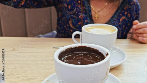 Churro Dipping into Hot Chocolate
