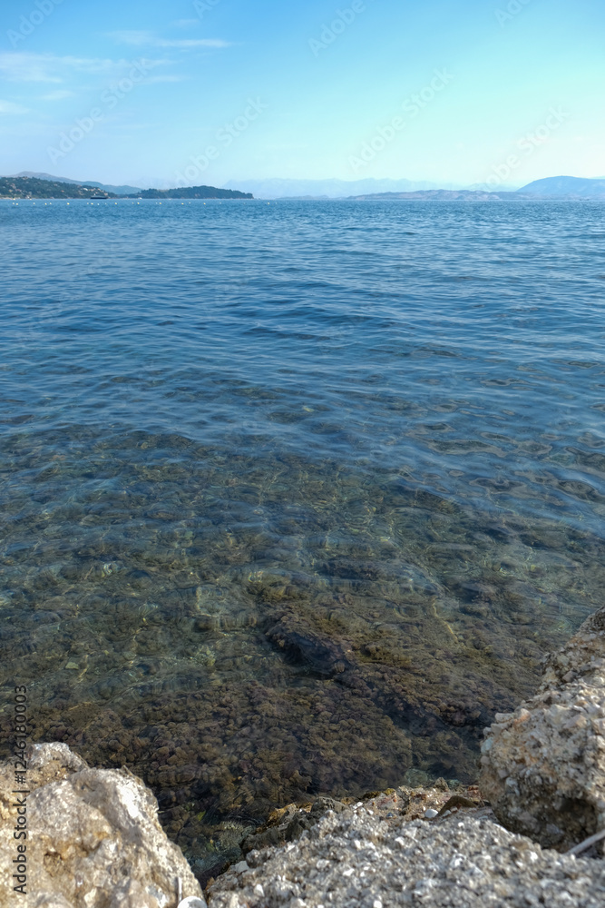 Clear Blue Water and Rocky Shore