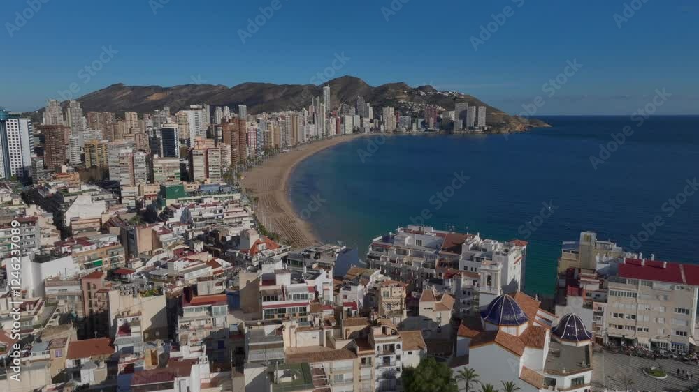 Benidorm city at Costa Blanca in Spain, Aerial Drone Shot. Skyscrappers along the Beach on Sea Shore, Playa de Levante. Benidorm city at Costa Blanca in Spain, Aerial Drone Shot. Skyscrappers along the Beach on Sea Shore, Playa de Levante.