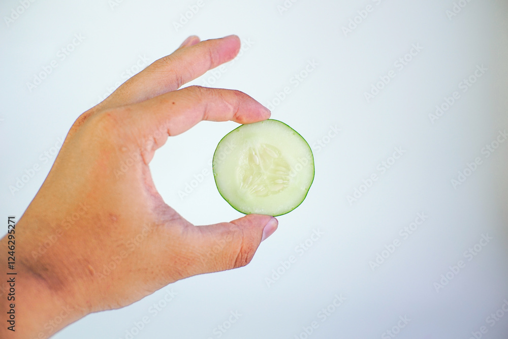 male hand hold cucumber, isolated on white background male hand hold cucumber, isolated on white background