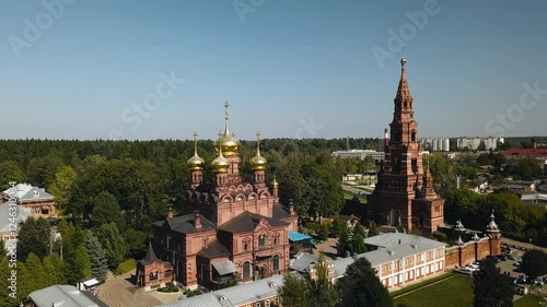 Wallpaper Mural A large red brick temple with golden domes on the outskirts of the city. Aerial photography Torontodigital.ca