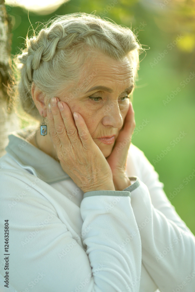 Portrait of senior sad woman in park Portrait of senior sad woman in park