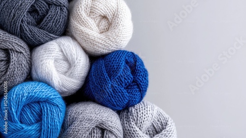 Colorful yarn balls on gray background, craft supplies