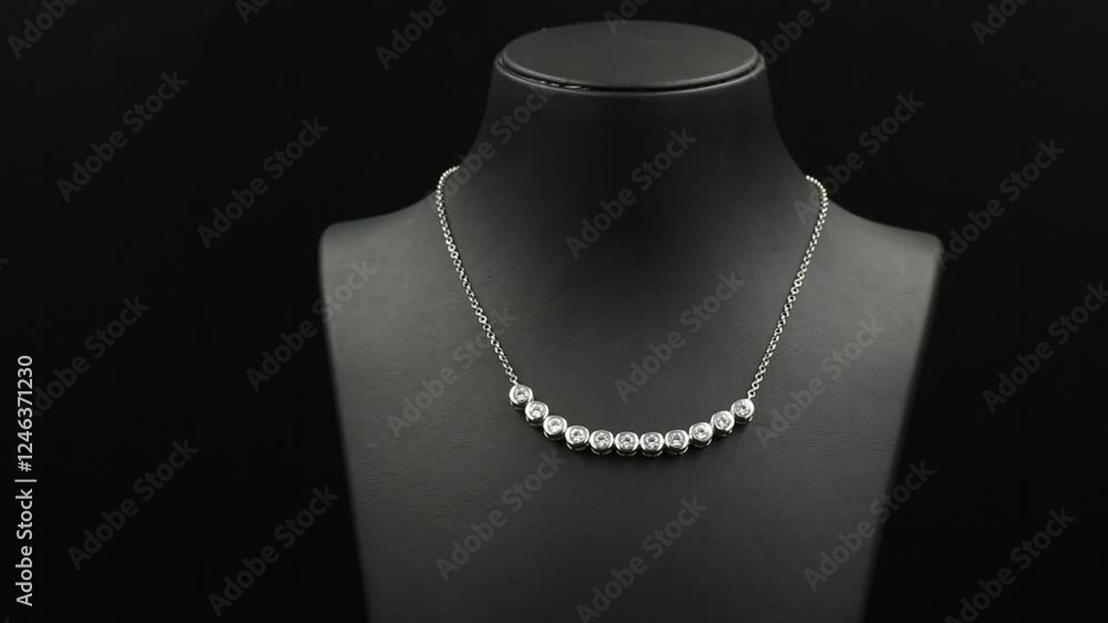 A stunning double-layered diamond necklace displayed on a sleek black jewelry bust, exuding elegance and sophistication. This high-quality 4K close-up video captures the intricate details. A stunning double-layered diamond necklace displayed on a sleek black jewelry bust, exuding elegance and sophistication. This high-quality 4K close-up video captures the intricate details.