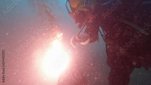 Commercial diver cutting steel underwater closeup