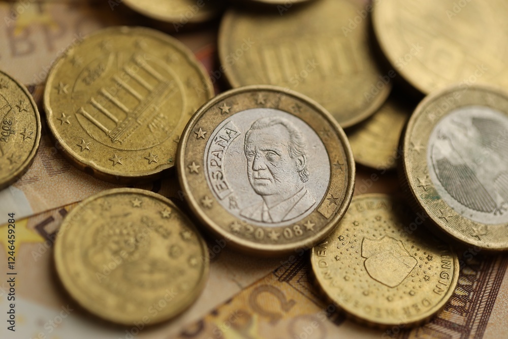 Many cent coins of euro currency lies on many fifty euro bills banknotes Many cent coins of euro currency lies on many fifty euro bills banknotes