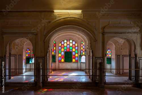 India. Rajasthan. Jaipur. Hawa Mahal. Multicolored stained glass windows of a room in the palace