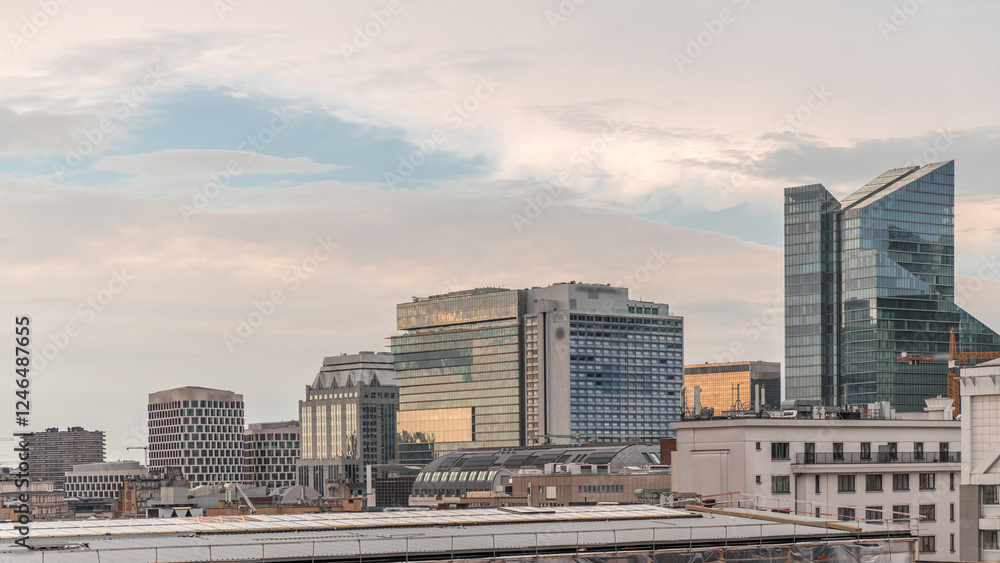 Aerial timelapse of modern skyscrapers and towers in Brussels with glass facades reflecting cloudy sky. Belgium Aerial timelapse of modern skyscrapers and towers in Brussels with glass facades reflecting cloudy sky. Belgium
