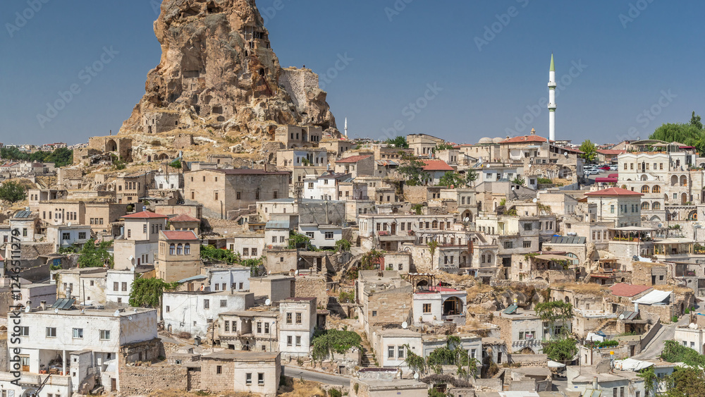 View of Ortahisar town old houses in rock formations from Ortahisar Castle aerial timelapse. View of Ortahisar town old houses in rock formations from Ortahisar Castle aerial timelapse.