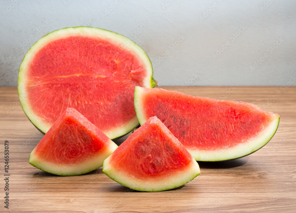 Fresh sliced watermelon on brown wooden table Fresh sliced watermelon on brown wooden table