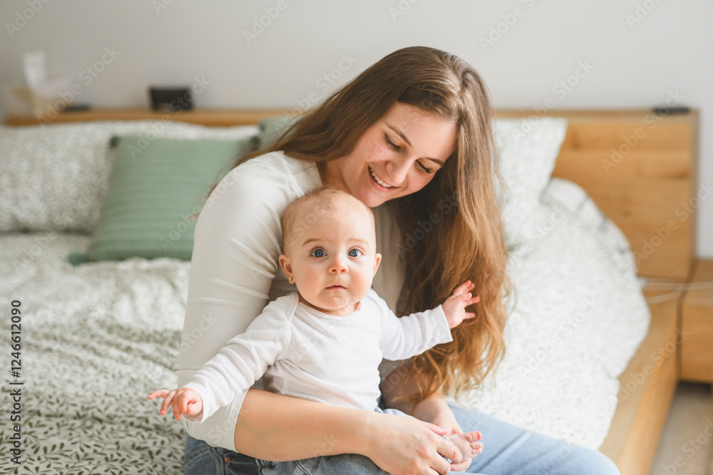 portrait of happy young mother and infant girl on bedroom portrait of happy young mother and infant girl on bedroom