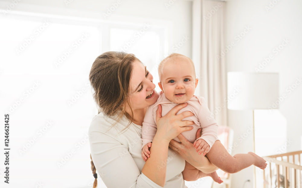 Cute small baby girl in bed at home. Woman holding little infant child. Cute small baby girl in bed at home. Woman holding little infant child.