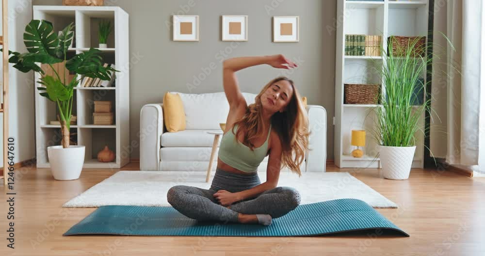 Fit woman practicing yoga at home enjoying healthy lifestyle and mindfulness
