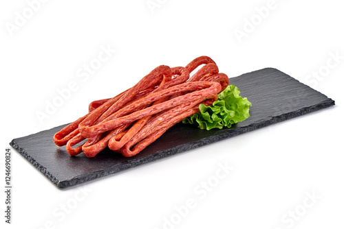 Kabanos thin dry sausage, snacks for beer, isolated on the white background. photo