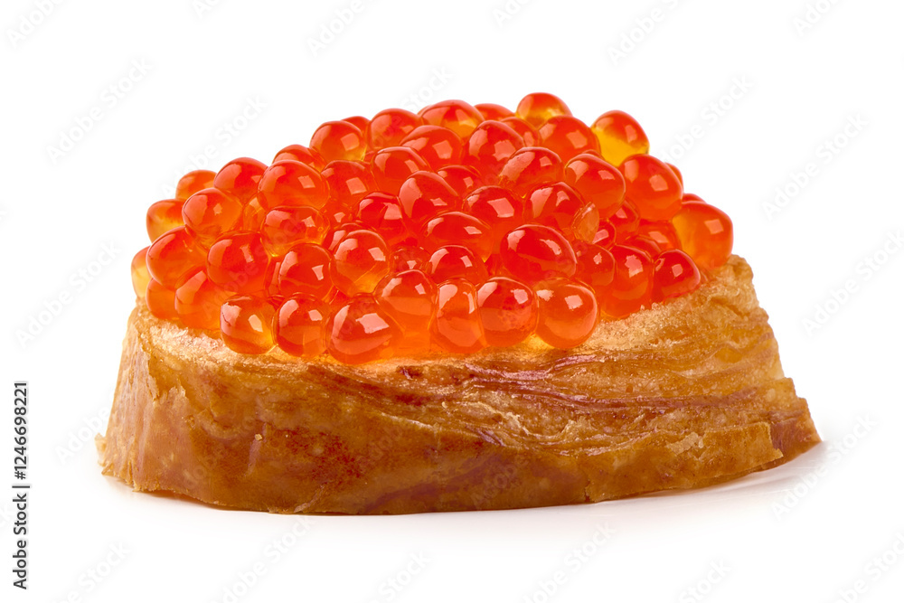 Red caviar on a crispy bread slice, isolated on white background. Red caviar on a crispy bread slice, isolated on white background.