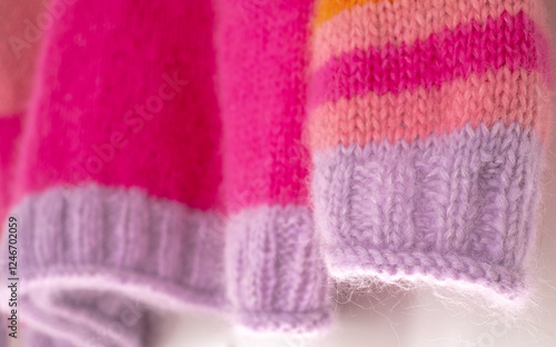 Pink and purple striped mohair and alpaca hand knitted sweater, knitted in stocking stitch and rib stitch with roll cuff. 