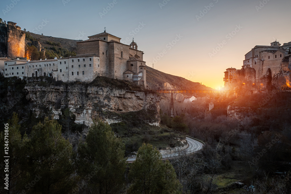 Fototapeta premium Explore ancient streets and stunning architecture in Cuenca, Spain during a picturesque sunset, cliff with castle