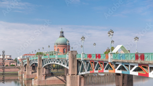 Saint Pierre Bridge over the Garonne River timelapse hyperlapse and La Grave Hospital. Toulouse, France photo