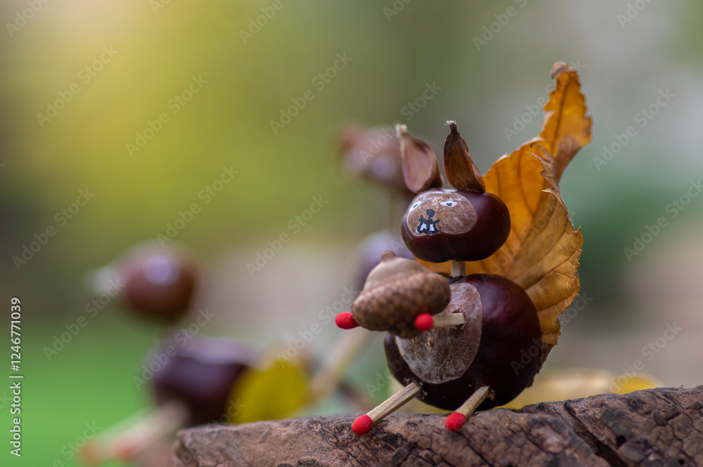 Funny chestnut squirell animal with cute face on natural background, traditional autumnal handcraft with children