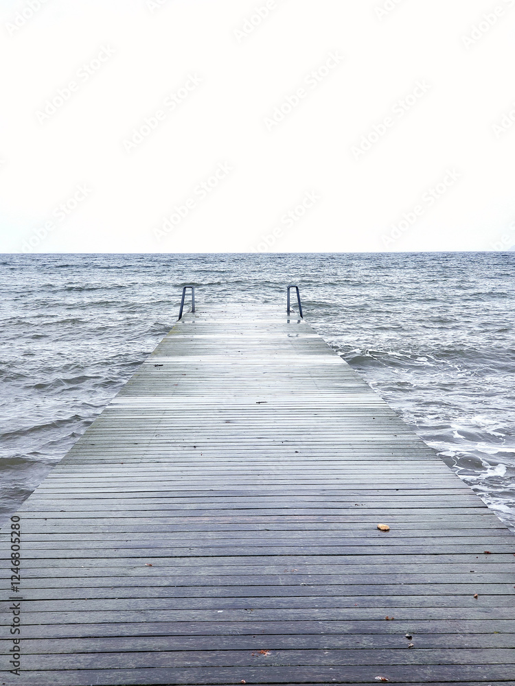 Fototapeta premium wooden deck entering the sea